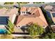 Aerial view of single-story home featuring desert landscaping, private backyard, and classic terracotta tile roofing at 2365 Black River Falls Dr, Henderson, NV 89044