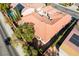Overhead shot of the home showcasing the terracotta roof, backyard, and surrounding suburban landscape at 2365 Black River Falls Dr, Henderson, NV 89044