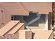 An aerial view of terracotta tile roof reveals a desert landscaped courtyard between wings of the single-story home at 2365 Black River Falls Dr, Henderson, NV 89044