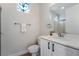 Bright bathroom features a white vanity, decorative window, and walk-in shower at 2365 Black River Falls Dr, Henderson, NV 89044