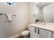 Cozy bathroom featuring white vanity, framed mirror, and toilet at 2365 Black River Falls Dr, Henderson, NV 89044