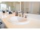 Bright bathroom featuring a white vessel sink, designer faucet, and modern countertop at 2365 Black River Falls Dr, Henderson, NV 89044