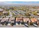 Panoramic aerial view of the community with multiple residences and desert landscape stretching to the horizon at 2365 Black River Falls Dr, Henderson, NV 89044