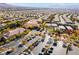Aerial view of the neighborhood clubhouse, tennis courts, landscaping, and surrounding community at 2365 Black River Falls Dr, Henderson, NV 89044