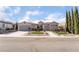 Charming single-story home featuring a well-manicured front yard, spacious driveway, and a two-car garage at 2365 Black River Falls Dr, Henderson, NV 89044
