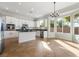 Open kitchen featuring a central island, stainless appliances, and natural light at 2365 Black River Falls Dr, Henderson, NV 89044