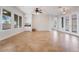 Spacious living room with a wet bar, large windows, and tiled flooring at 2365 Black River Falls Dr, Henderson, NV 89044
