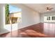Spacious living room with hardwood floors, recessed lighting, and sliding glass doors to the backyard at 2365 Black River Falls Dr, Henderson, NV 89044