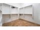 Spacious walk-in closet with ample shelving and tile flooring at 2365 Black River Falls Dr, Henderson, NV 89044