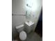 Bathroom featuring a white vanity, toilet, and tiled floor at 2564 San Marcos St, Las Vegas, NV 89115
