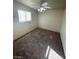 Neutral bedroom featuring a ceiling fan with light and natural light from a window at 2564 San Marcos St, Las Vegas, NV 89115