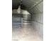 Shed interior with shelving, offering organized storage solutions for various needs at 2564 San Marcos St, Las Vegas, NV 89115