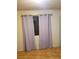 Cozy bedroom with wood floors and curtains for privacy at 2720 Knightsbridge Rd, Henderson, NV 89074