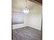 Dining area featuring new gray flooring and contemporary chandelier lighting at 2720 Knightsbridge Rd, Henderson, NV 89074