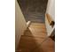 Carpeted staircase with wooden handrail leading to the upper level at 2720 Knightsbridge Rd, Henderson, NV 89074