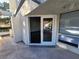 Outdoor patio area with view into the living room with sliding glass doors at 2761 Lodestone Dr # 63, Las Vegas, NV 89117