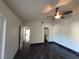 Spacious bedroom features vaulted ceilings, wood-look tile, and a modern ceiling fan at 2761 Lodestone Dr # 63, Las Vegas, NV 89117
