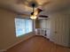 Cozy bedroom with a ceiling fan, window and built-in closet is move-in ready at 2761 Lodestone Dr # 63, Las Vegas, NV 89117