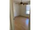 Bedroom features ceiling fan, a window for natural light, and wood-look floors at 2761 Lodestone Dr # 63, Las Vegas, NV 89117