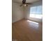 Bedroom features ceiling fan, a window for natural light, and wood-look floors at 2761 Lodestone Dr # 63, Las Vegas, NV 89117
