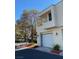 Two-story exterior with a two-car garage, balcony, desert landscaping, and neutral color scheme at 2761 Lodestone Dr # 63, Las Vegas, NV 89117