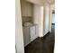 Convenient laundry room with a washer, dryer, and upper cabinets for storage at 2761 Lodestone Dr # 63, Las Vegas, NV 89117