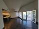 Spacious living room with hardwood floors and a view of the outdoor patio at 2761 Lodestone Dr # 63, Las Vegas, NV 89117