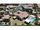 Aerial view of a backyard with a pool, patio, and well-maintained landscaping, creating a private outdoor oasis at 2785 Rosenhearty Dr, Henderson, NV 89044