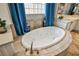 Large bathtub with tile surround and luxury faucet at 2785 Rosenhearty Dr, Henderson, NV 89044