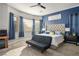 Charming bedroom features a plush bed, complemented by a unique accent wall at 2785 Rosenhearty Dr, Henderson, NV 89044