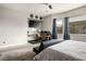 This stylish bedroom also features a functional home office setup with natural light at 2785 Rosenhearty Dr, Henderson, NV 89044