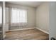 Bright bedroom with hardwood flooring and natural light, complemented by neutral wall paint at 2785 Rosenhearty Dr, Henderson, NV 89044