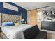 Bright bedroom features a plush bed, complemented by a unique accent wall at 2785 Rosenhearty Dr, Henderson, NV 89044