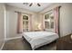 Comfortable bedroom with neutral walls, carpet, and pink curtains at 2785 Rosenhearty Dr, Henderson, NV 89044