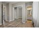 Bright bedroom has plank floors and mirrored closet doors at 2785 Rosenhearty Dr, Henderson, NV 89044