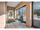 Bright exercise room with weight equipment, large windows, and views of the backyard pool and patio at 2785 Rosenhearty Dr, Henderson, NV 89044