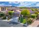 Beautiful single-story home with a well-manicured lawn and a two-car garage at 2785 Rosenhearty Dr, Henderson, NV 89044