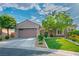 Charming single-story home with desert landscaping, a spacious driveway, and a two-car garage at 2785 Rosenhearty Dr, Henderson, NV 89044