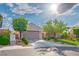 Inviting single-story home features a manicured lawn, desert landscaping, and a convenient two-car garage at 2785 Rosenhearty Dr, Henderson, NV 89044
