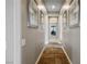 The neutral hallway features stylish tile floors and decorative framed art pieces at 2785 Rosenhearty Dr, Henderson, NV 89044