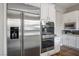 Close up of stainless steel appliances including refrigerator, double oven and microwave in modern kitchen at 2785 Rosenhearty Dr, Henderson, NV 89044