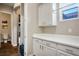 Laundry room with white cabinets, ample counter space, and a view at 2785 Rosenhearty Dr, Henderson, NV 89044