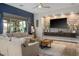 Cozy living room featuring modern decor, wood flooring, and access to the backyard at 2785 Rosenhearty Dr, Henderson, NV 89044