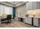 Home office with custom white cabinets, modern desk, and unique decor for an efficient workspace at 2785 Rosenhearty Dr, Henderson, NV 89044