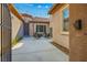 Back patio featuring an outdoor seating area, desert landscaping, and string lights at 2785 Rosenhearty Dr, Henderson, NV 89044