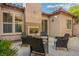 Backyard patio featuring an outdoor fireplace and seating area at 2785 Rosenhearty Dr, Henderson, NV 89044