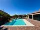 Backyard pool with an outdoor kitchen and luxurious lounge areas at 2785 Rosenhearty Dr, Henderson, NV 89044
