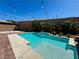 Backyard pool with palm trees and elegant lighting, perfect for outdoor entertainment at 2785 Rosenhearty Dr, Henderson, NV 89044