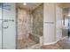 Modern walk-in shower boasts stylish tile work and a convenient built-in bench at 2785 Rosenhearty Dr, Henderson, NV 89044
