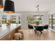 Bright open kitchen and dining area with bar seating and exterior view at 2917 Golf Links Dr, Las Vegas, NV 89134